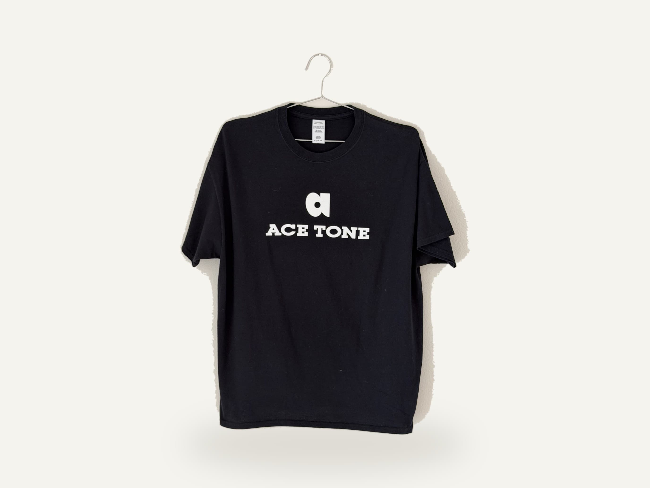 ACE TONE® Logo Tee — black cotton tee with the white ACE TONE logo mark screen-printed on the chest