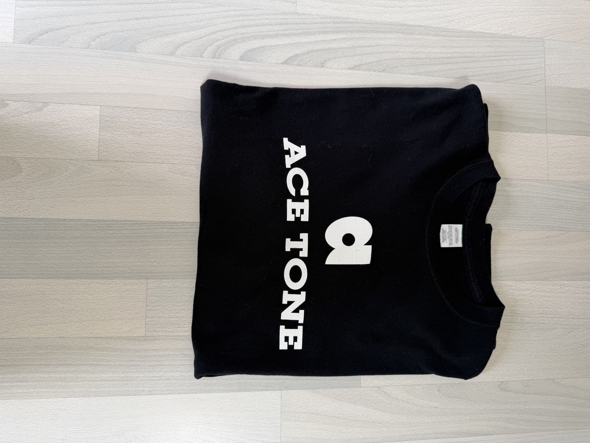 ACE TONE® Logo Tee folded, showing the printed mark